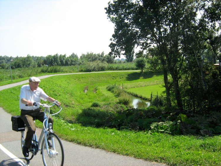 elderly-man-rides-in-countryside